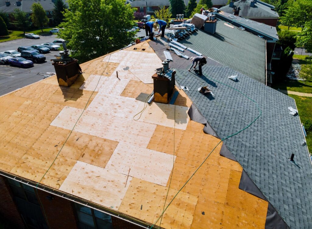 roofing contractors on top of roof